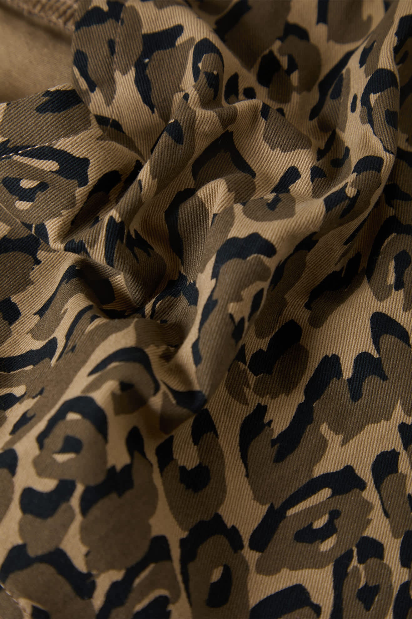 Women's Magnolia Tie Top in the color Brown Cheetah - Additional Laydown image