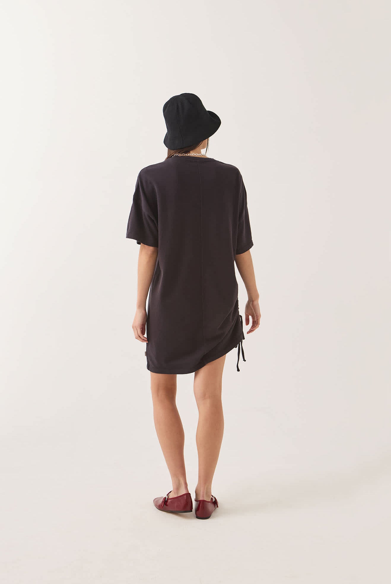 Women's Carefree Organic Garment Dye T-Shirt Dress in the color Black - Women's Back View