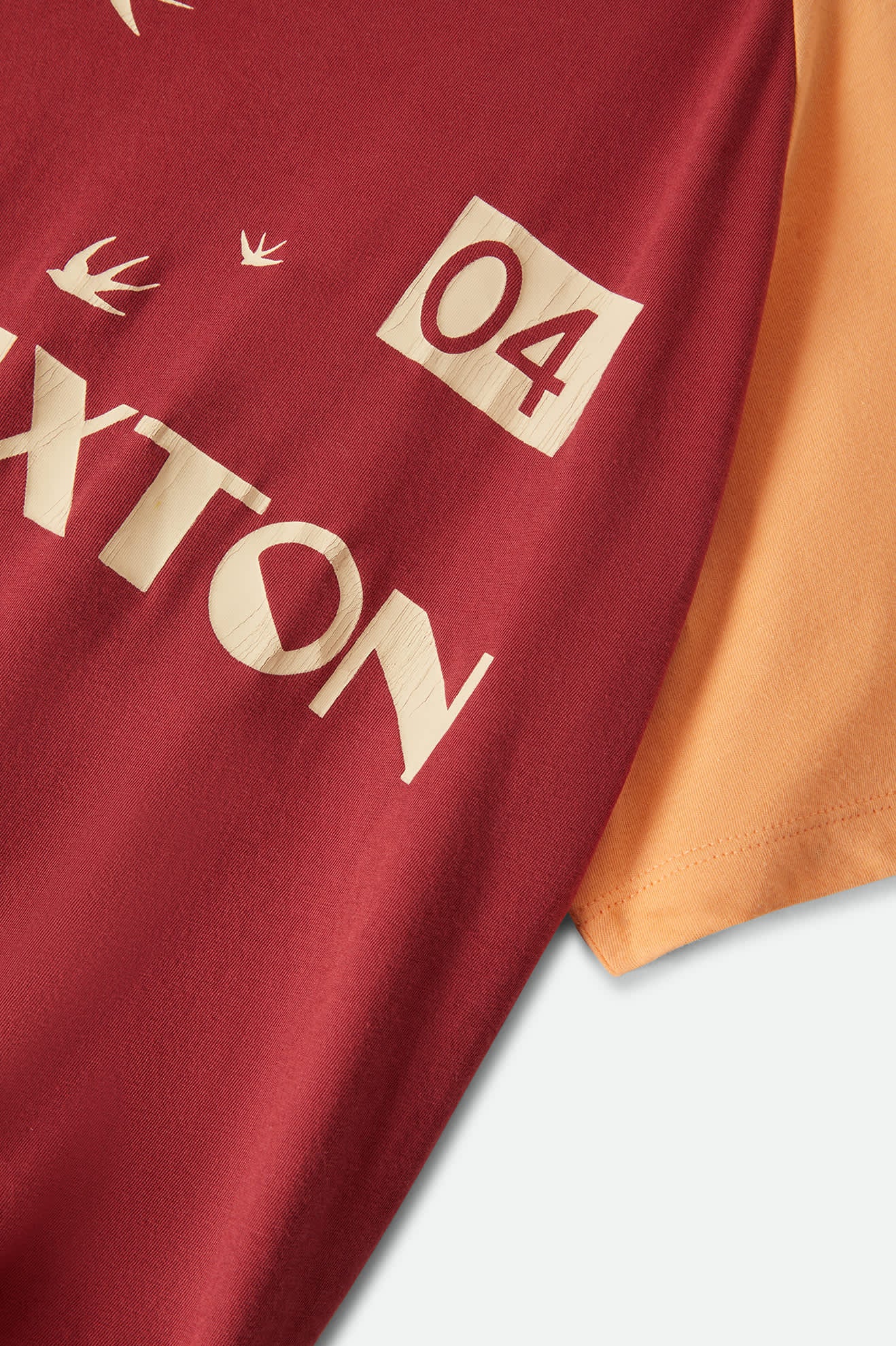 Women's Swallow Sky Cropped Raglan in the color Robust Red/Peach Cobbler - Additional Laydown image