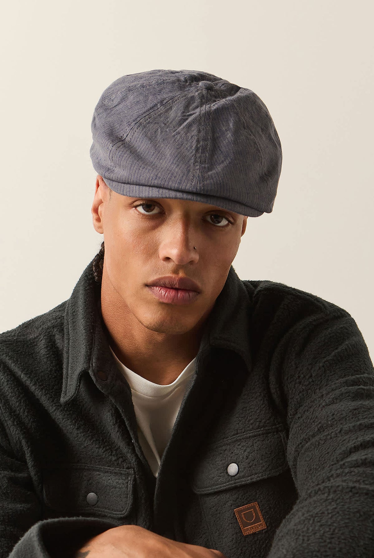 Unisex Brood Newsboy Cap in the color Indigo/Dark Sand - Men's Front View