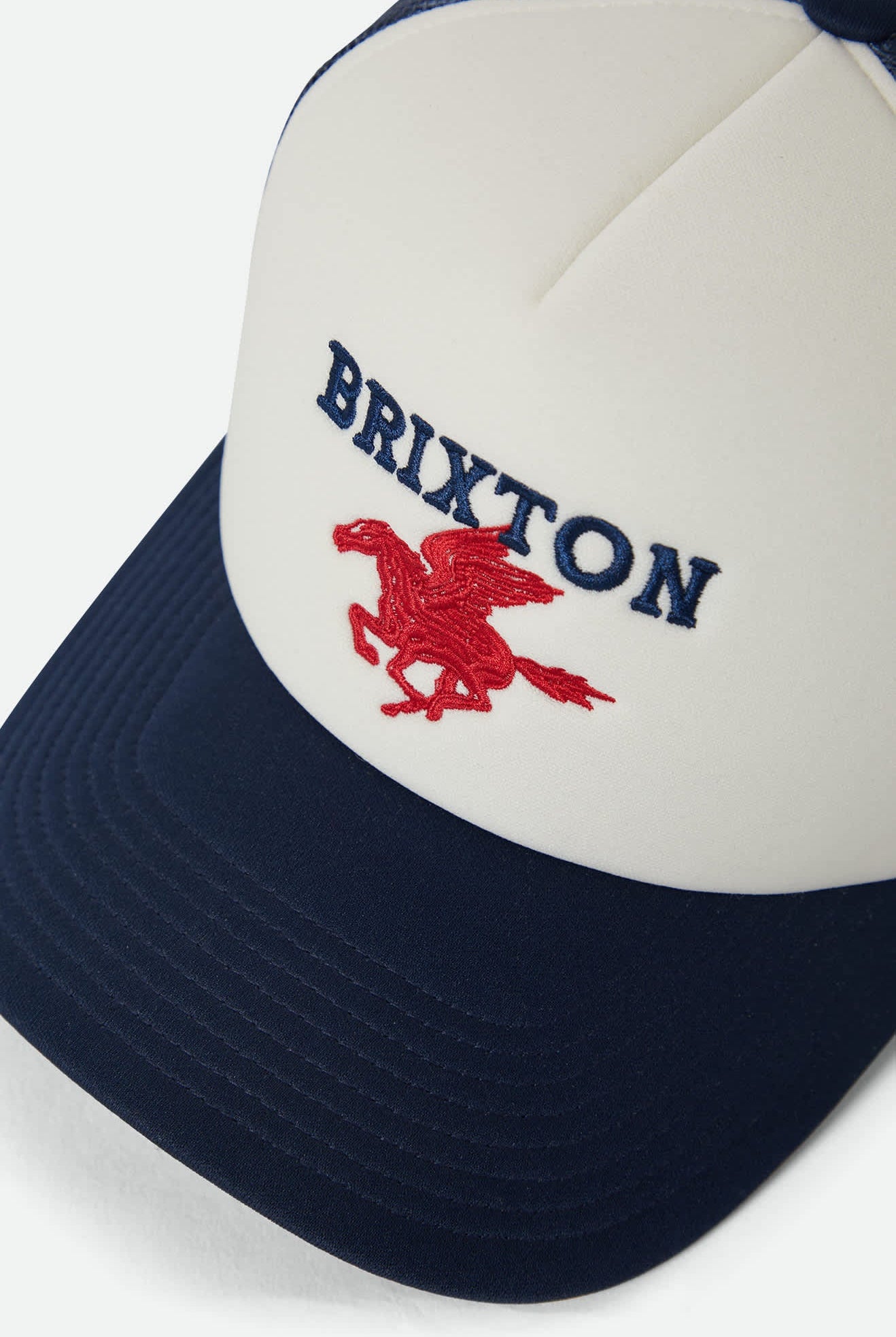 Unisex Pegasus NetPlus Trucker Hat in the color Whitecap/Navy - Additional Laydown image