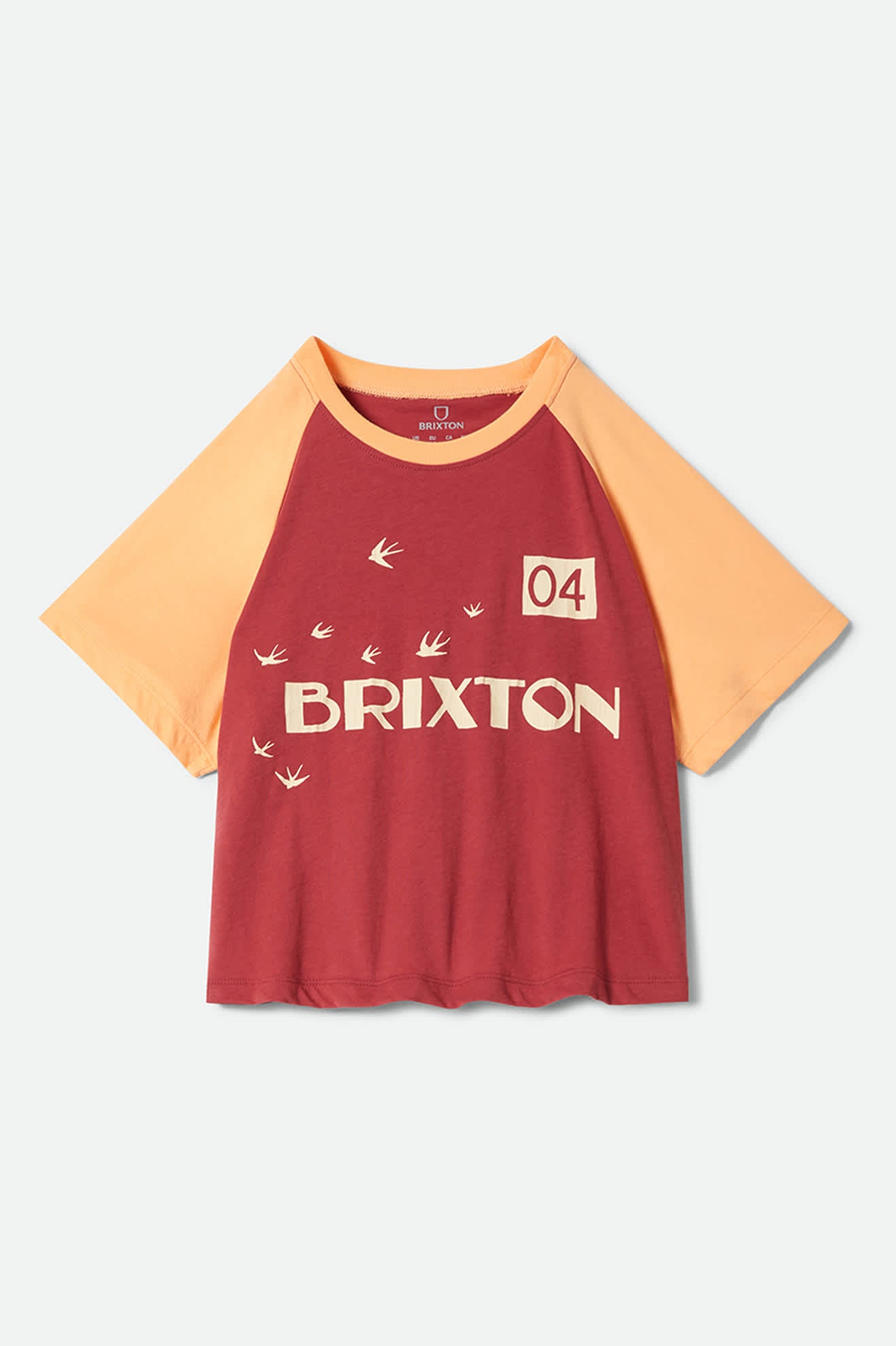 Women's Swallow Sky Cropped Raglan in the color Robust Red/Peach Cobbler - Front Product Laydown Image