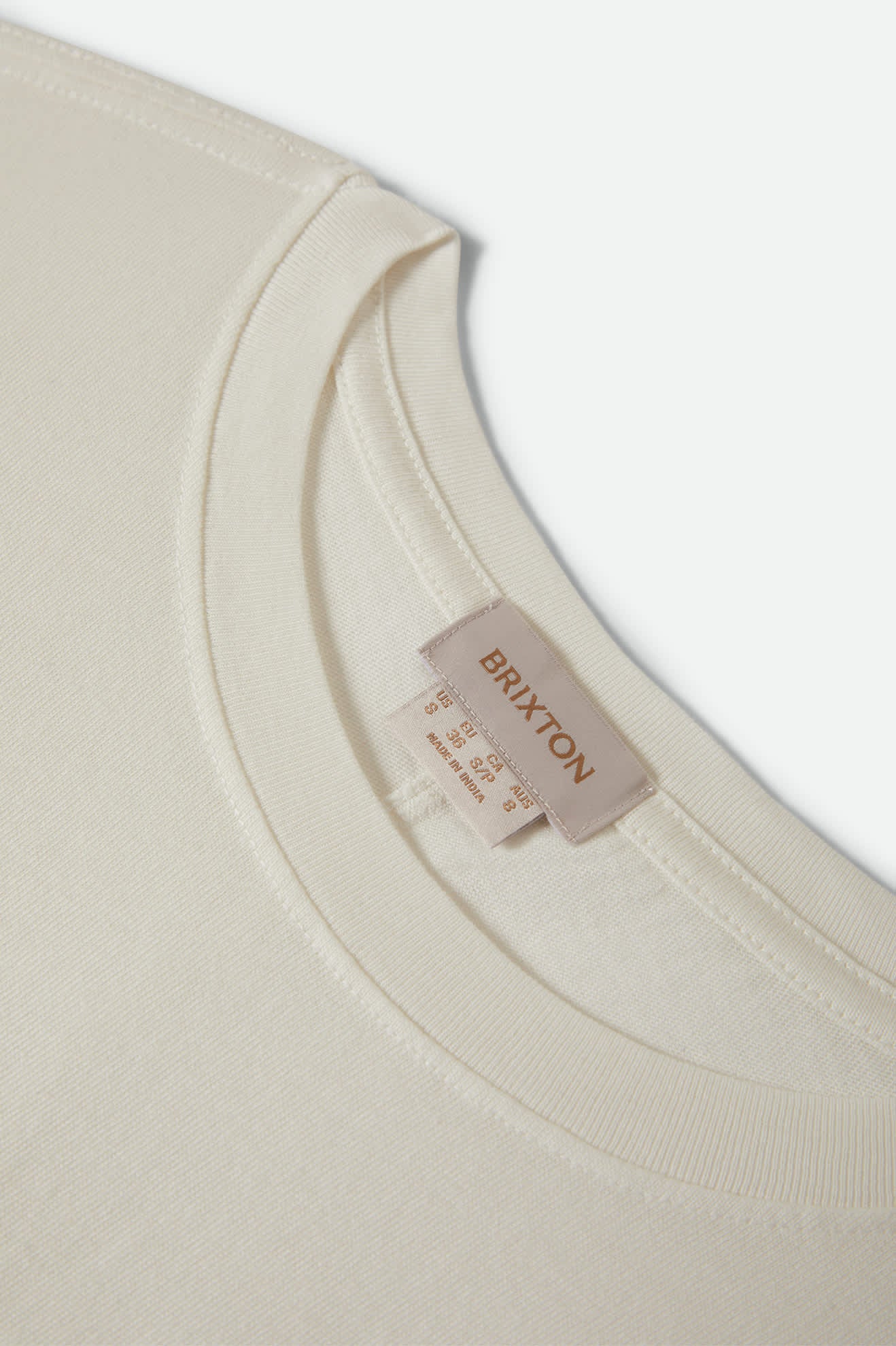 Women's Carefree Organic Garment Dye Cinch T-Shirt in the color Off White - Additional Laydown image