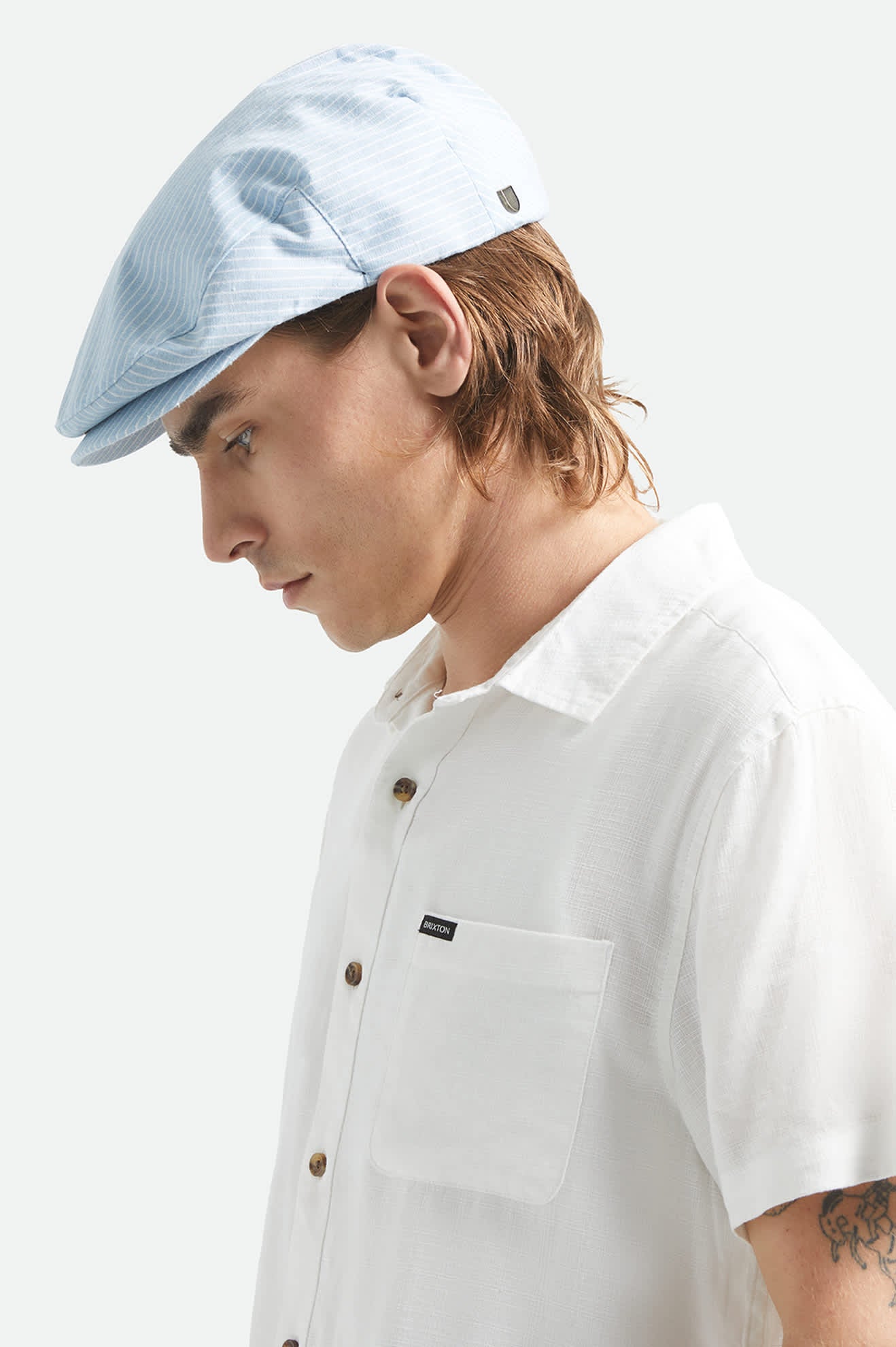 Unisex Hooligan Flat Cap in the color Light Blue/White - Men's Side View