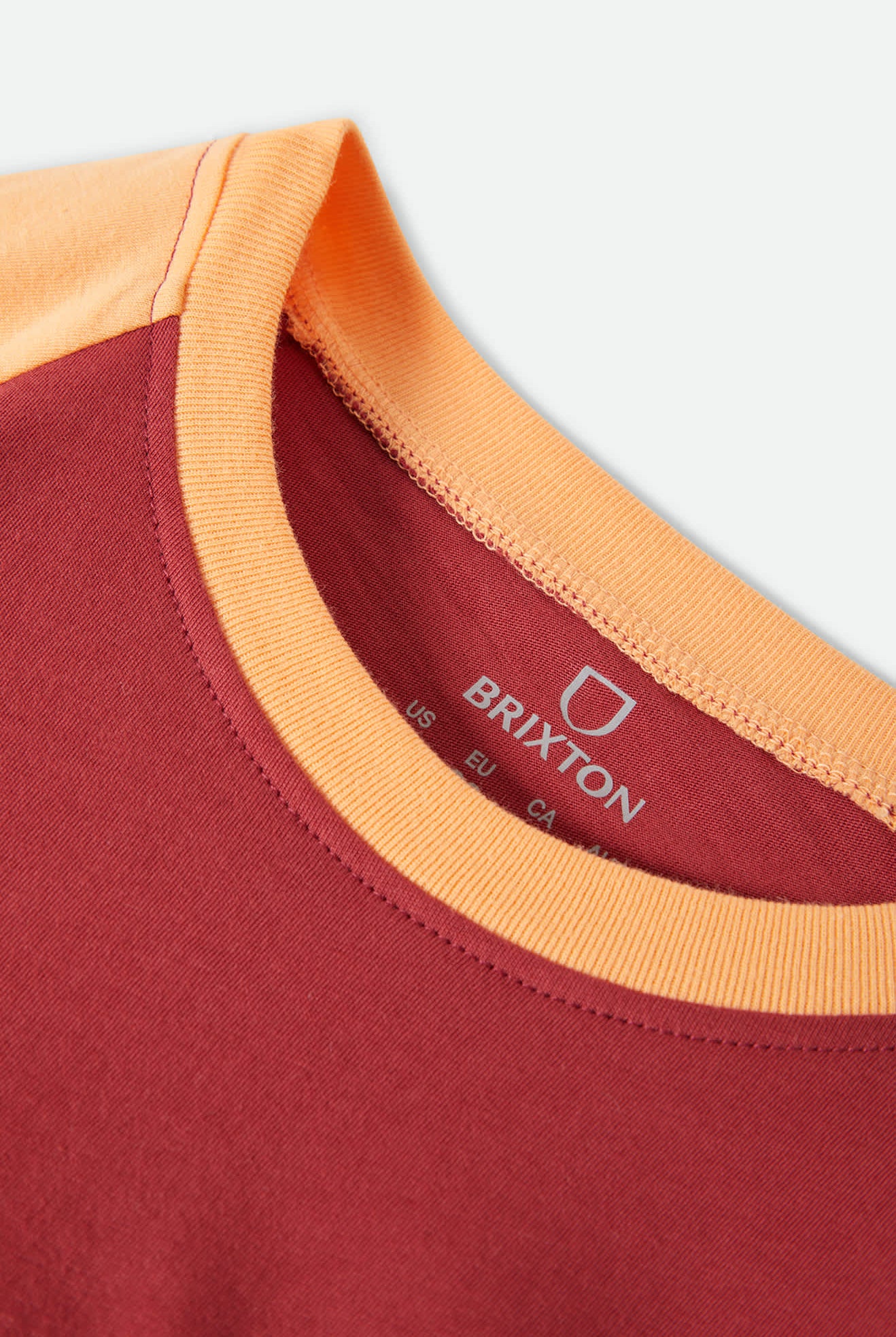 Women's Swallow Sky Cropped Raglan in the color Robust Red/Peach Cobbler - Additional Laydown image