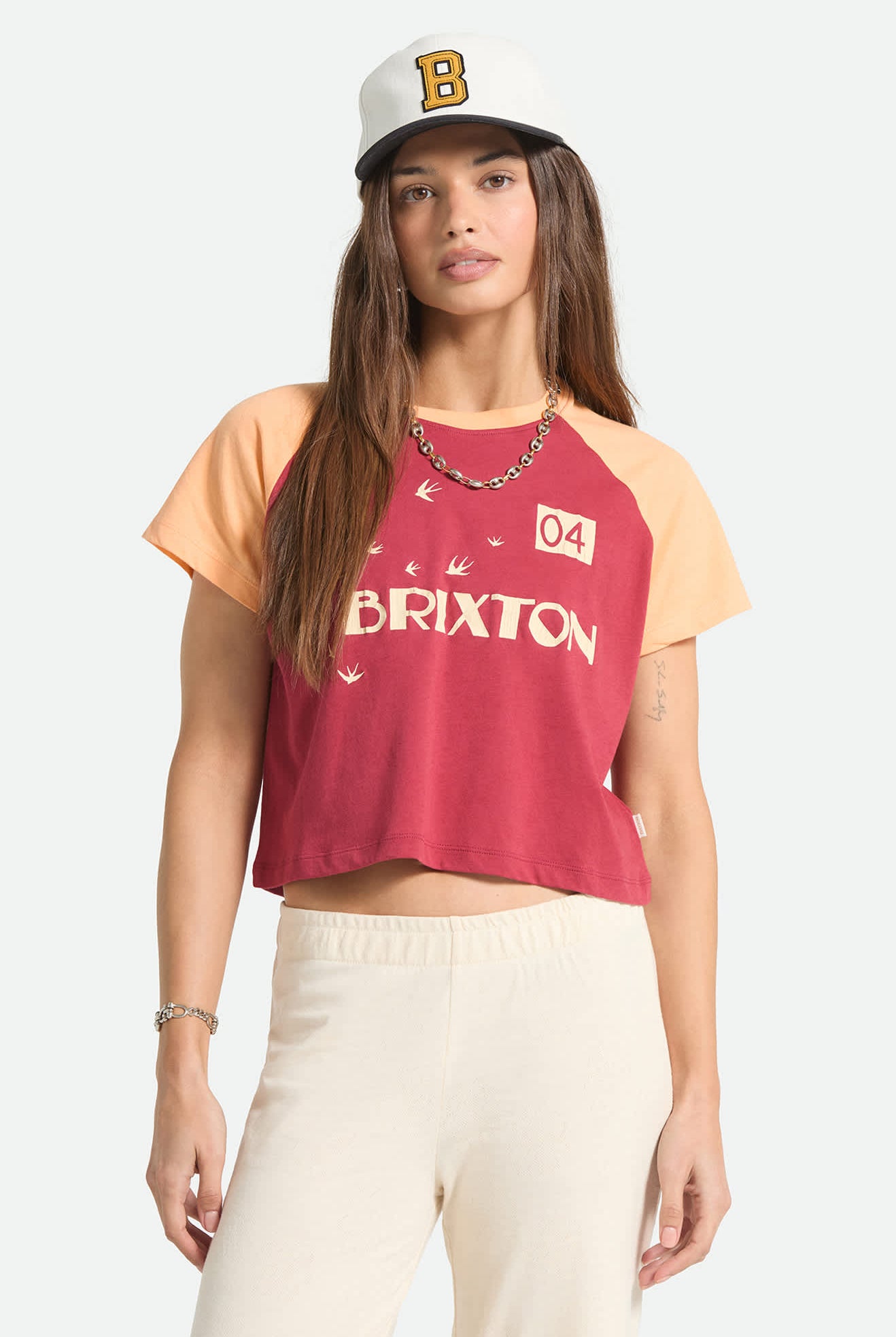 Women's Swallow Sky Cropped Raglan in the color Robust Red/Peach Cobbler - Women's Front Fit Image