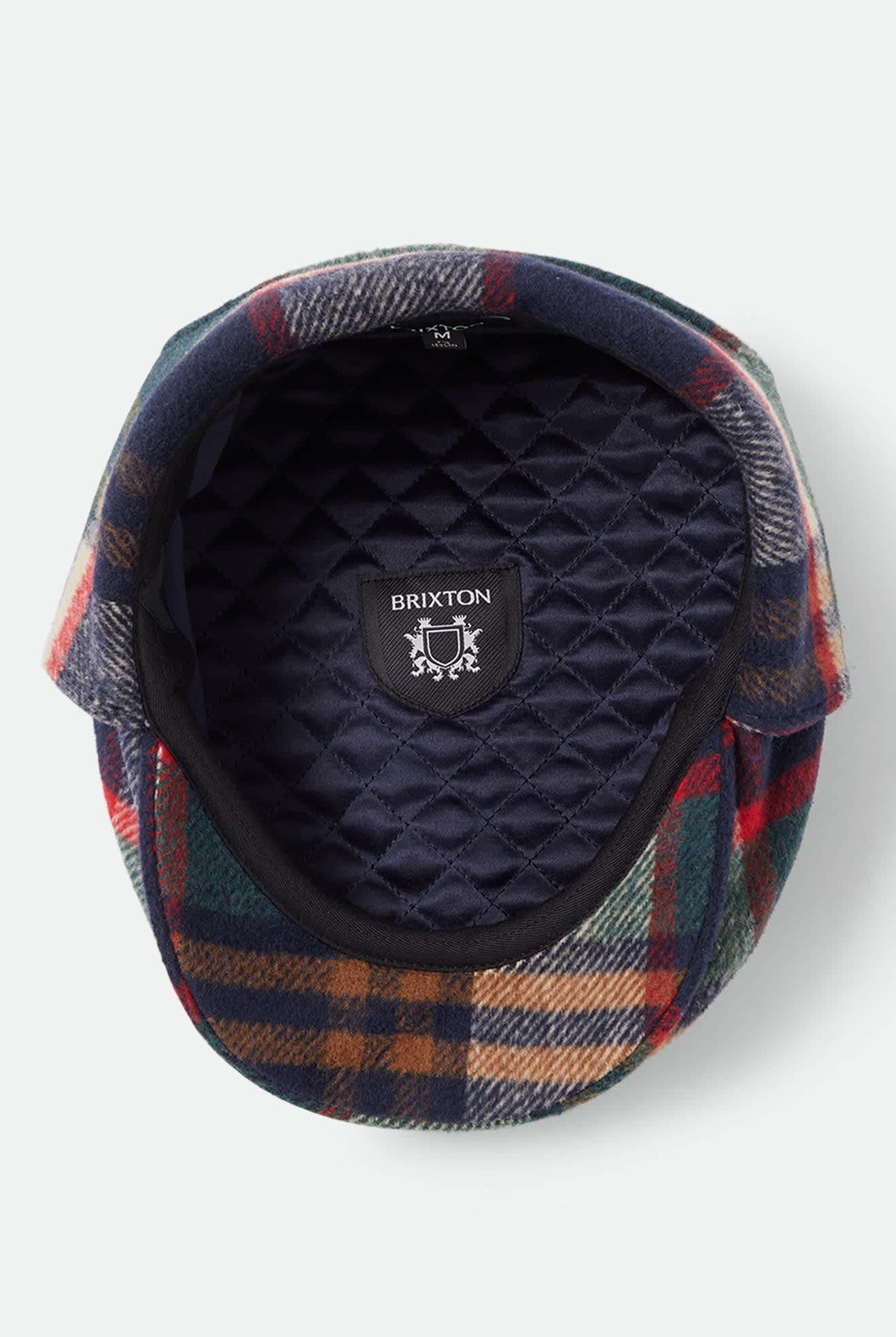 Unisex Barrel Earflap Snap Cap in the color Navy/Green/Red/Cream - Additional Laydown image