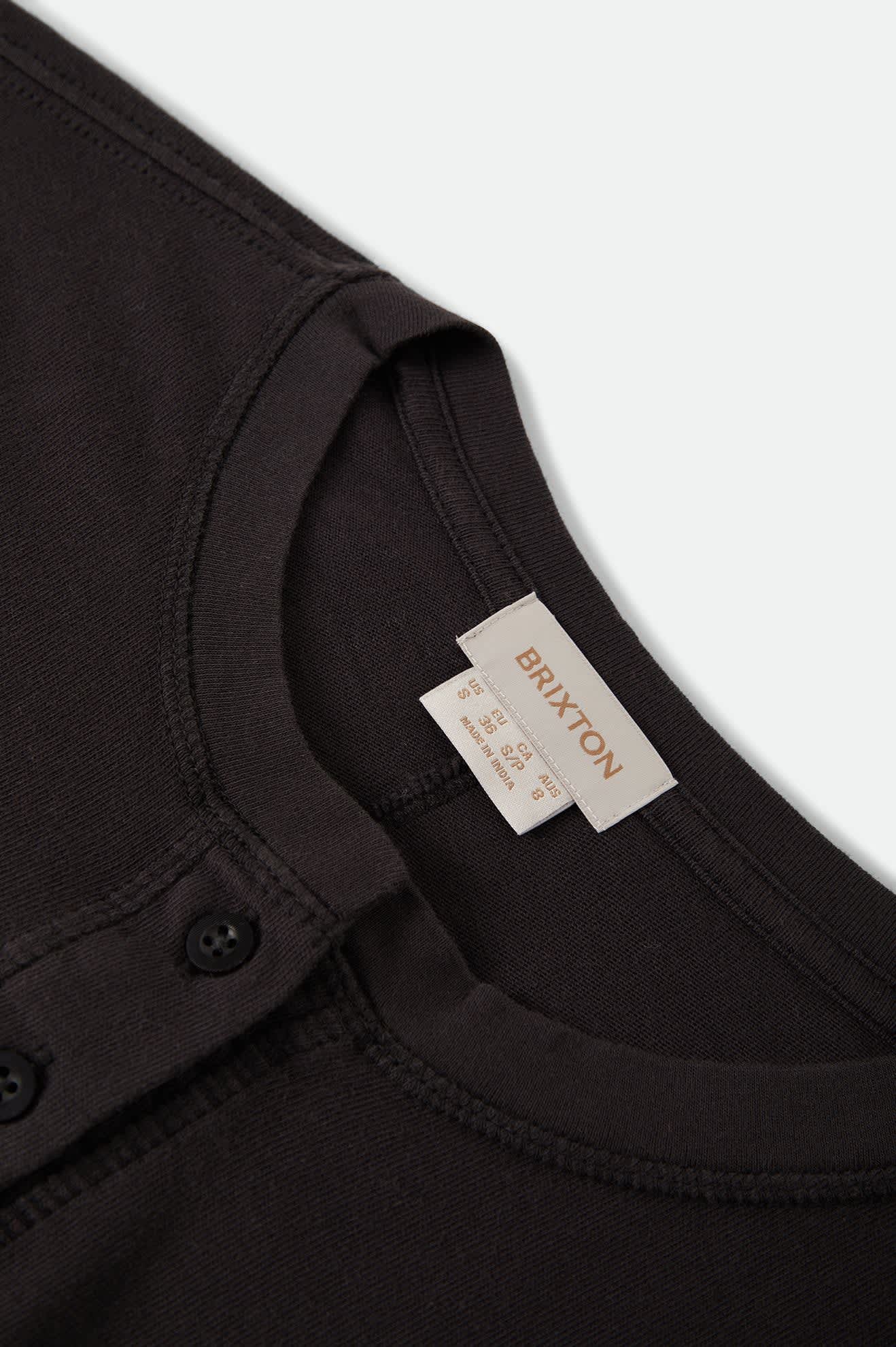 Women's Carefree Organic Garment Dye Cropped Henley in the color Black - Additional Laydown image