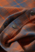 Men's Builders Bowery Performance Flannel in the color Solar Orange/Bering Sea - Additional Laydown image