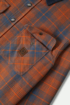 Men's Builders Bowery Performance Flannel in the color Solar Orange/Bering Sea - Additional Laydown image