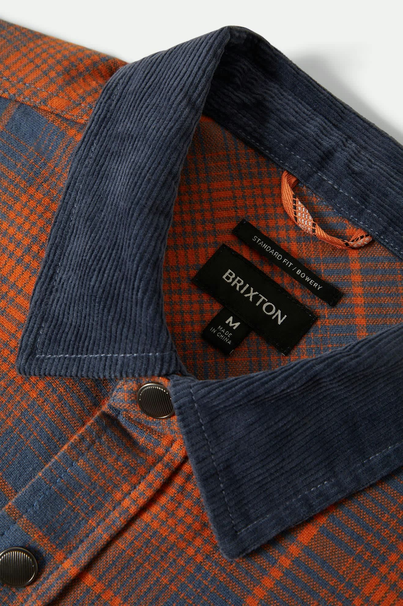 Men's Builders Bowery Performance Flannel in the color Solar Orange/Bering Sea - Additional Laydown image