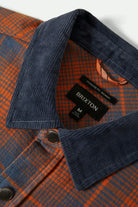 Men's Builders Bowery Performance Flannel in the color Solar Orange/Bering Sea - Additional Laydown image