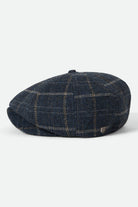 Unisex Brood Newsboy Cap in the color Mood Indigo/Tan - Additional Laydown image