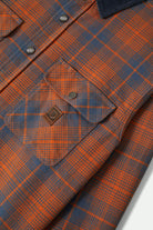 Men's Builders Bowery Performance Flannel in the color Solar Orange/Bering Sea - Additional Laydown image