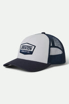 Unisex Regal Netplus Trucker Hat in the color Washed Navy/White/Washed Navy - Front Product View