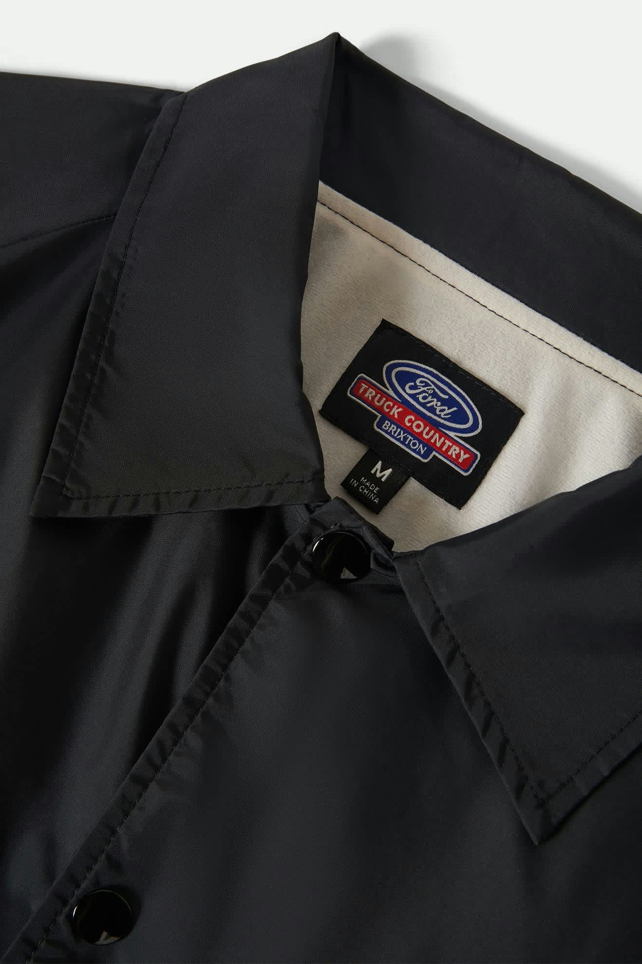 Men's Ford Built Tough Windbreaker in the color Burnt Rubber - Additional Laydown image