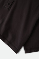 Women's Carefree Organic Garment Dye Cropped Henley in the color Black - Additional Laydown image