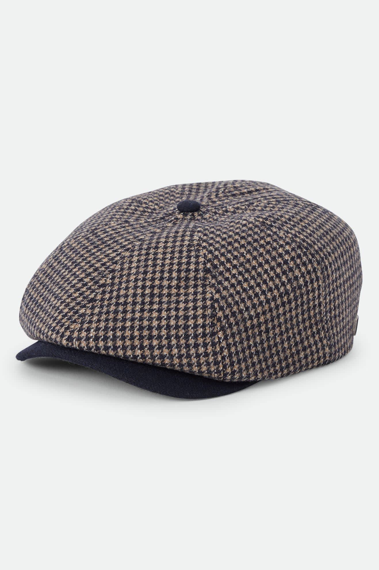 Unisex Brood Newsboy Cap in the color Navy/Sand Houndstooth - Front Product Laydown Image
