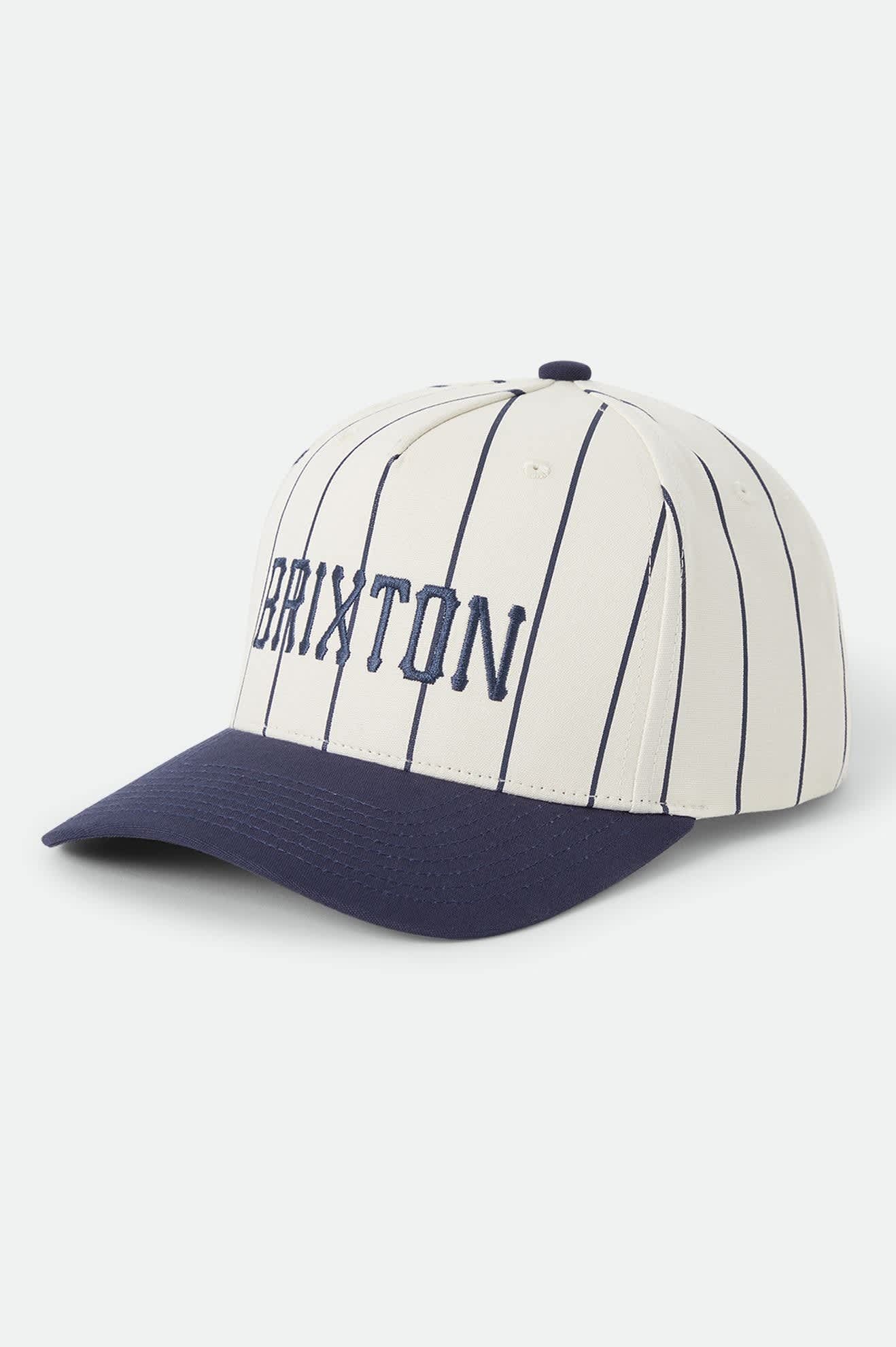 Unisex Homerun Snapback in the color Off White/Washed Navy - Front Product Laydown Image