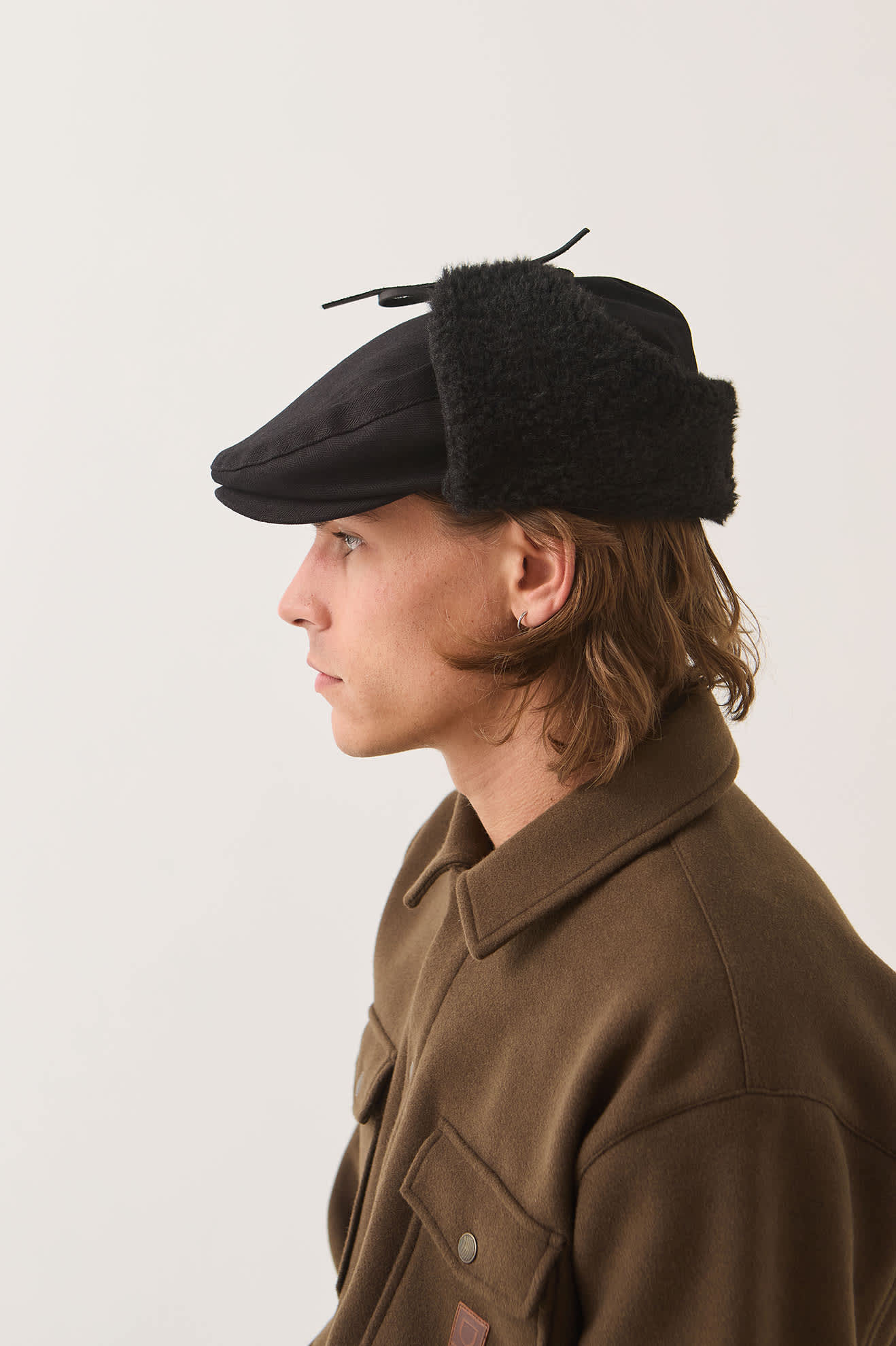 Unisex Barrel Earflap Snap Cap in the color Black/Black - Men's Side View