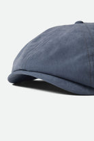 Unisex Brood Newsboy Cap in the color Slate Blue Brushed Satin - Additional Laydown image
