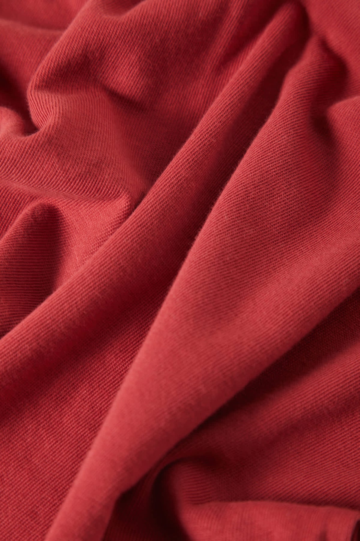 Women's Carefree Organic Garment Dye Cropped Tank in the color Robust Red - Additional Laydown image