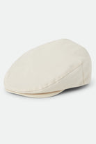 Unisex Hooligan Flat Cap in the color Egret White - Front Product Laydown Image