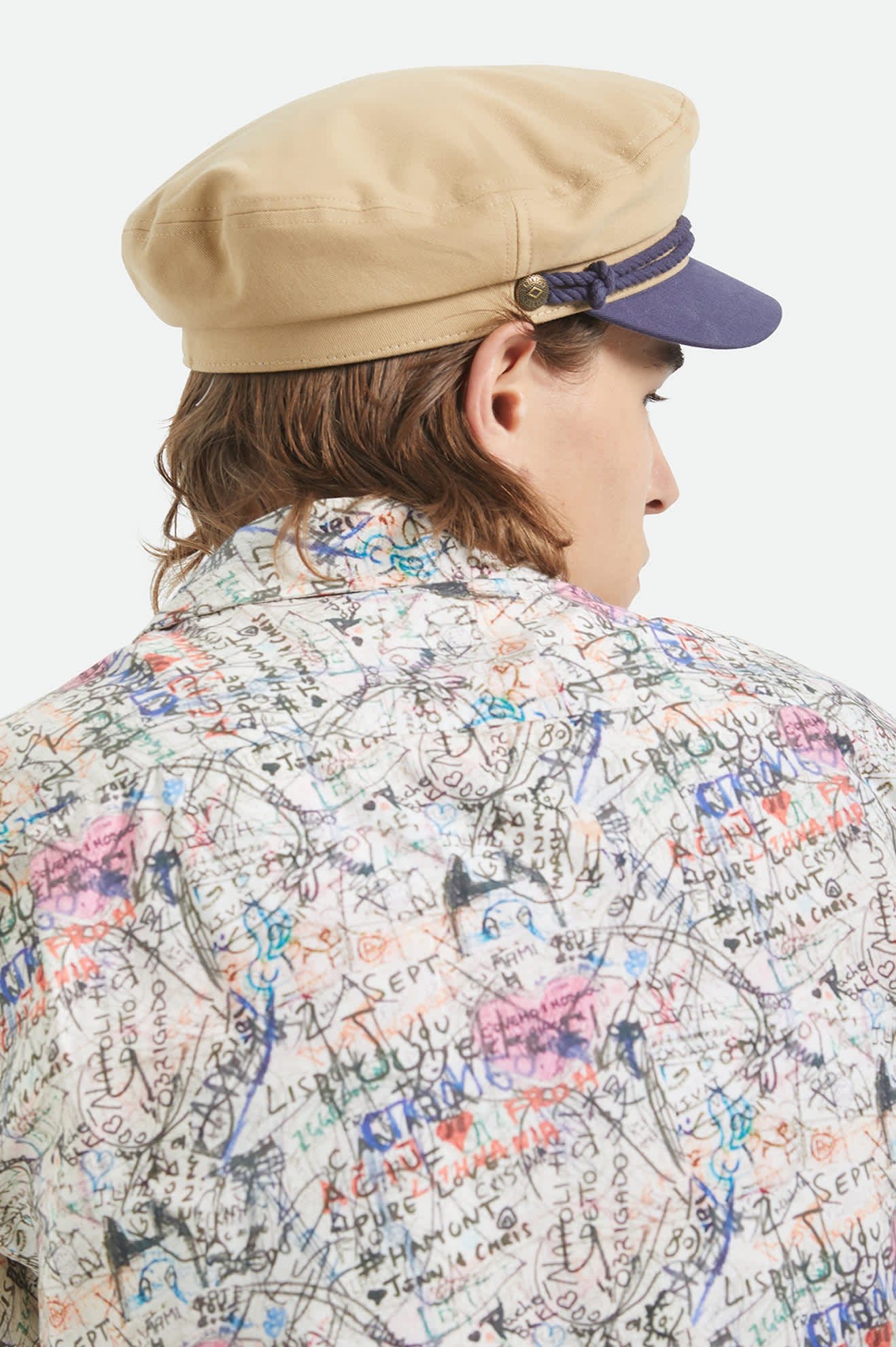 Unisex Fiddler Fisherman Cap in the color Sand/Washed Navy - Men's Back View