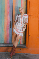 Women's The Cinch Button Down Short Sleeve Dress in the color Lost In Reality Print - Men's Lifestyle image