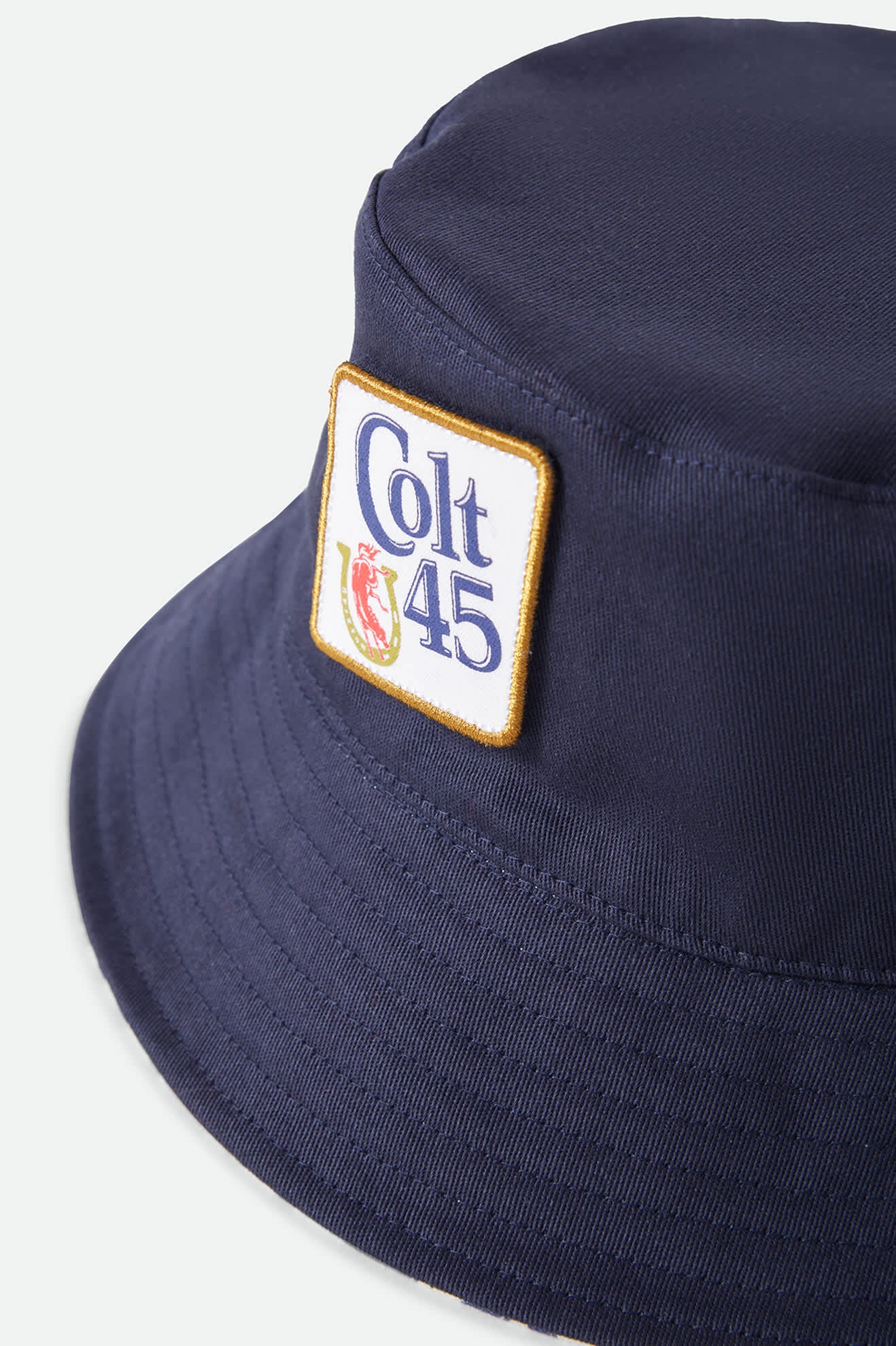 Unisex Colt 45 X Brixton Bucket Hat in the color Multi/Midnight Blue - Additional Laydown image