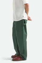 Men's Builders Carpenter Stretch Pant in the color Primary Green - Men's Side View