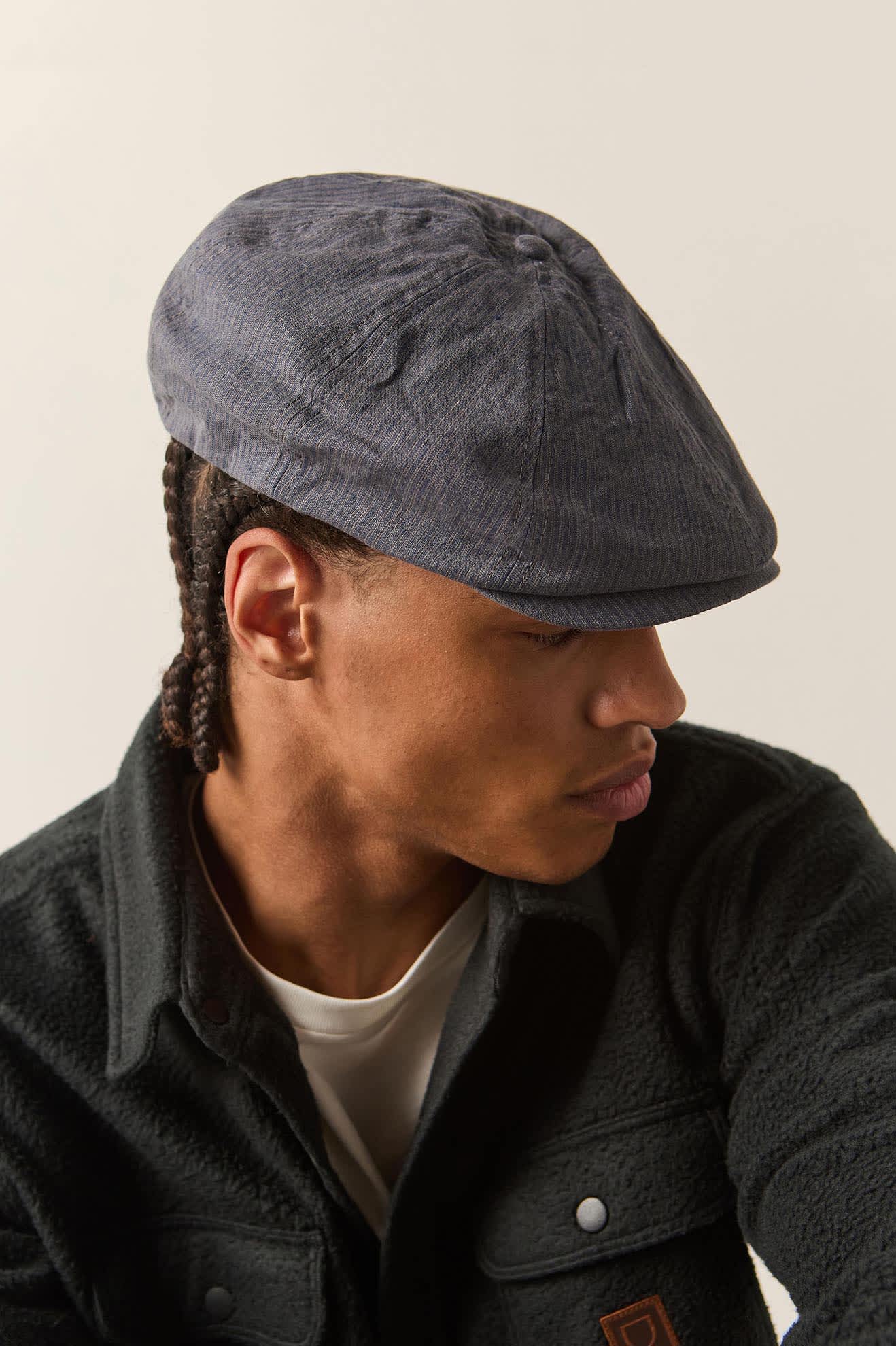 Unisex Brood Newsboy Cap in the color Indigo/Dark Sand - Men's Side View