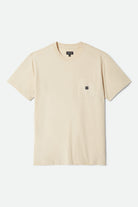 Men's Beta Sheild Short Sleeve Pocket T-Shirt in the color Cream - Front Product Laydown Image