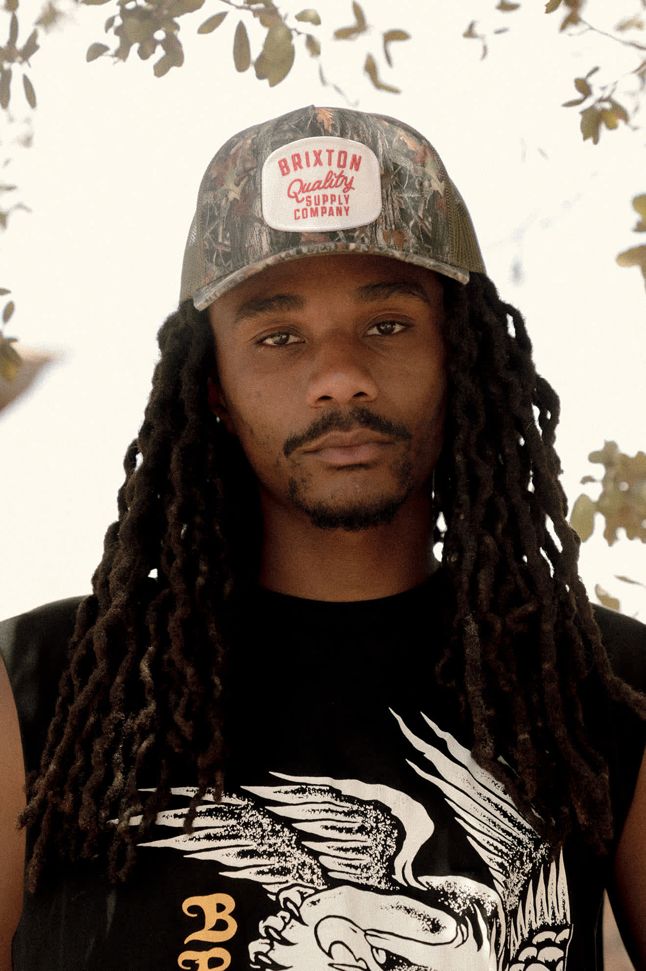 Unisex Hubal Netplus Trucker Hat in the color Tree Camo/Olive - Men's Lifestyle 3.0