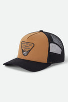 Unisex Blighton Trucker Hat in the color Dusted Ochre/Black - Front Product Laydown Image