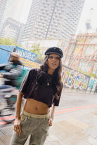 Women's Carefree Organic Garment Dye Cropped Henley in the color Black - Women's Lifestyle 1