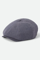 Unisex Brood Newsboy Cap in the color Indigo/Dark Sand - Front Product Laydown Image