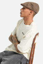 Unisex Hooligan Lightweight Flat Cap in the color Grey/Brown/Gold - Men's Side View